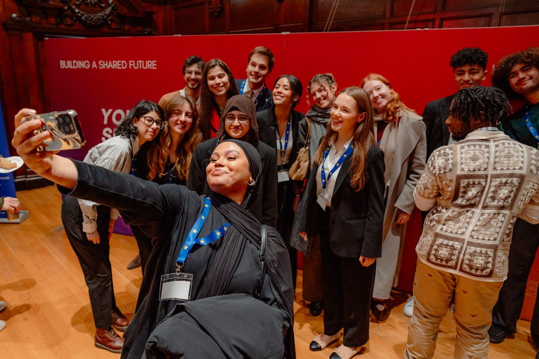 Delegates taking a group selfie at the 2025 Dialogue