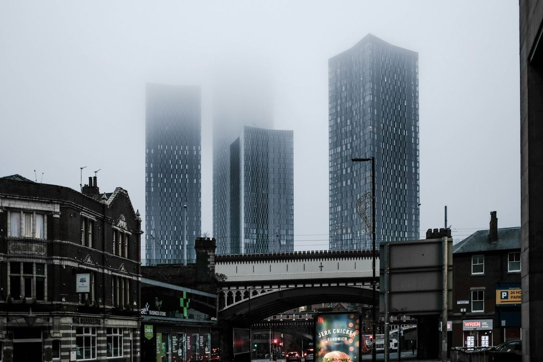 Manchester city buildings under a white sky